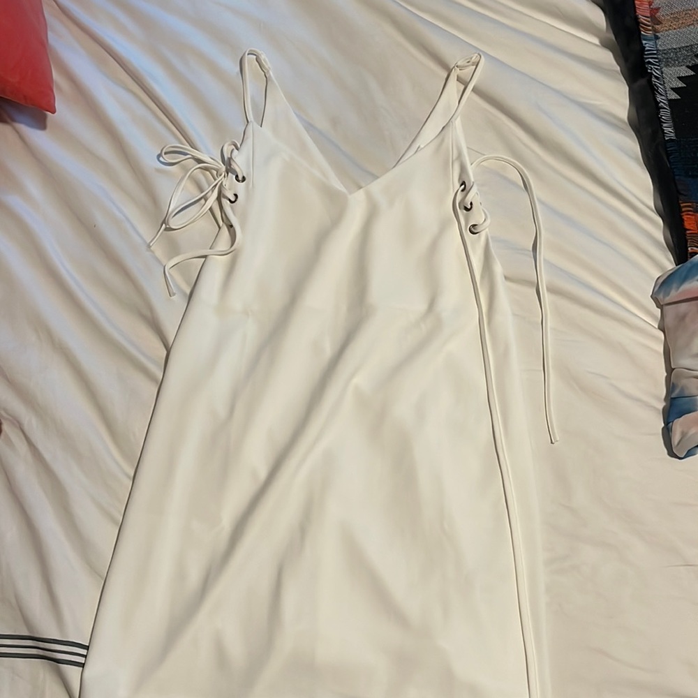 White Sleeveless dress with laced up sides. Size Medium. Only worn once.